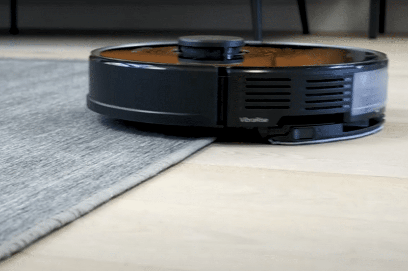 The Roborock S7 drives onto a carpet